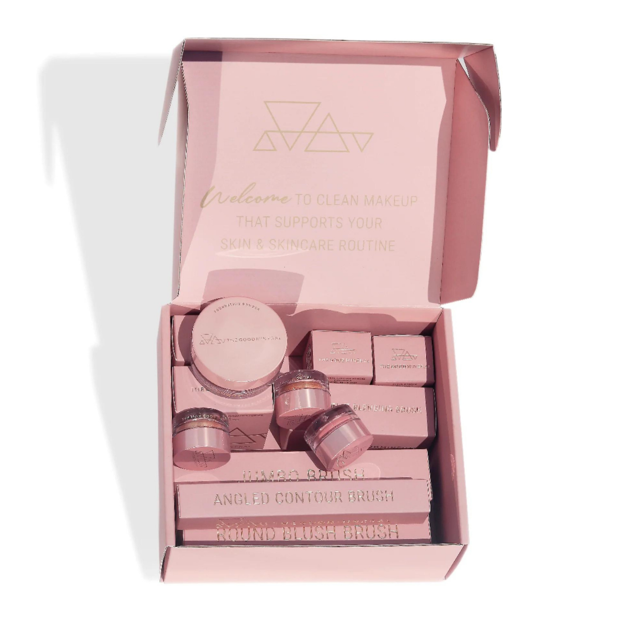 The Good Mineral Gift Box. Image is of a beautiful, soft-pink, closed gift box. The text on the box is in gold foil and says YOU ARE GOLDEN next to The Good Mineral Logo and triangle symbol. The gift box dimensions are 